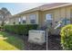 Backyard view of a home featuring an backup generator, satellite dish and hedges at 5363 Nw 153Rd Ct, Morriston, FL 32668