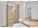 Bathroom showcasing a glass shower, toilet, sink, and vanity with neutral tones and elegant fixtures at 5363 Nw 153Rd Ct, Morriston, FL 32668