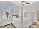 Bedroom with lots of natural light, a ceiling fan, and hardwood floors at 5363 Nw 153Rd Ct, Morriston, FL 32668