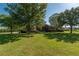 Beautiful home with a sprawling front lawn, mature trees, and well-maintained landscaping at 5363 Nw 153Rd Ct, Morriston, FL 32668