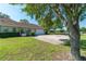 Charming single-story home, lush lawn, and an attached two-car garage with a wide driveway at 5363 Nw 153Rd Ct, Morriston, FL 32668