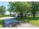Beautiful home with attached two-car garage, lush landscaping, and a spacious driveway at 5363 Nw 153Rd Ct, Morriston, FL 32668
