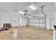 Spacious two-car garage featuring a large window and a convenient automatic door opener at 5363 Nw 153Rd Ct, Morriston, FL 32668