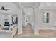 Hallway with archways, light hardwood floors and natural light at 5363 Nw 153Rd Ct, Morriston, FL 32668