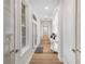 Bright hallway with hardwood floors, arched doorways, and natural light, showcasing a spacious feel at 5363 Nw 153Rd Ct, Morriston, FL 32668
