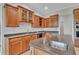 Kitchen island with stainless steel sink, granite counters, and lots of storage at 5363 Nw 153Rd Ct, Morriston, FL 32668