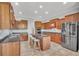Large kitchen with island, stainless appliances, and ample cabinet storage at 5363 Nw 153Rd Ct, Morriston, FL 32668