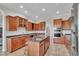Spacious kitchen with a large island, stainless steel appliances, and plenty of cabinets at 5363 Nw 153Rd Ct, Morriston, FL 32668