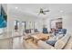 Open-concept living room with seamless indoor-outdoor flow through French doors at 5363 Nw 153Rd Ct, Morriston, FL 32668