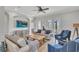 Inviting living room with hardwood floors, ceiling fan, and doors leading to the outside at 5363 Nw 153Rd Ct, Morriston, FL 32668