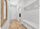Mudroom features tile flooring, coat hooks, storage cabinets, and access to a laundry room at 5363 Nw 153Rd Ct, Morriston, FL 32668