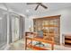 Well-appointed office space with ample storage and natural light through a nearby door at 5363 Nw 153Rd Ct, Morriston, FL 32668