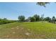 Wide view of a house with a large lawn at 5363 Nw 153Rd Ct, Morriston, FL 32668