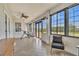 Relaxing sunroom featuring tiled floor, a ceiling fan and lots of natural light and comfortable seating at 5363 Nw 153Rd Ct, Morriston, FL 32668