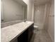 Bright bathroom showcasing vanity sink and shower with modern fixtures at 593 Marion Oaks Trl, Ocala, FL 34473