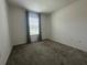 Cozy bedroom with neutral carpet and a window with light-filtering blinds at 593 Marion Oaks Trl, Ocala, FL 34473