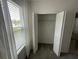 Bedroom closet shown with standard shelving behind bifold doors at 593 Marion Oaks Trl, Ocala, FL 34473
