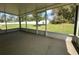 Enclosed porch provides views of the private fenced backyard at 593 Marion Oaks Trl, Ocala, FL 34473