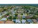 Community aerial view with a home highlighted by a red marker, showcasing neighborhood layout and nearby amenities at 710 Antonia Ln, The Villages, FL 32159