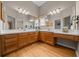 Bathroom featuring a double vanity with ample counter space and generous lighting at 710 Antonia Ln, The Villages, FL 32159
