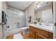 Bathroom featuring a shower-tub combo, white cabinets and white countertop at 710 Antonia Ln, The Villages, FL 32159