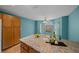Bright dining area with a large island, granite countertops and ample natural light at 710 Antonia Ln, The Villages, FL 32159