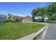 Charming single-story home with a manicured lawn and a spacious three car garage at 710 Antonia Ln, The Villages, FL 32159