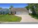 Charming single-story home featuring a two-car garage and well-maintained landscaping at 710 Antonia Ln, The Villages, FL 32159