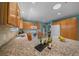Open kitchen with granite countertops, wooden cabinets and stainless steel appliances at 710 Antonia Ln, The Villages, FL 32159