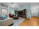 Cozy living room with stylish furnishings, wood floors, and plenty of natural light, creating a warm ambiance at 710 Antonia Ln, The Villages, FL 32159