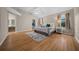 Serene primary bedroom featuring wood floors, and an ensuite bath at 710 Antonia Ln, The Villages, FL 32159