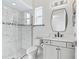 Bright bathroom featuring a tiled shower, modern vanity, and sleek black hardware at 7161 Ne 22Nd Court Rd, Ocala, FL 34479
