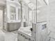 Luxury bathroom showcasing dual vanities, freestanding tub, and walk-in shower with decorative tiling at 7161 Ne 22Nd Court Rd, Ocala, FL 34479