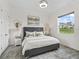 Cozy bedroom with a modern bed, stylish decor, and a view of the outdoors at 7161 Ne 22Nd Court Rd, Ocala, FL 34479