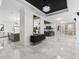 Expansive foyer featuring marble floors and elegant chandelier at 7161 Ne 22Nd Court Rd, Ocala, FL 34479