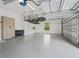 Clean, spacious garage with ample storage cabinets and hanging racks for efficient organization at 7161 Ne 22Nd Court Rd, Ocala, FL 34479