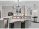 Gray kitchen features a large island with modern appliances at 7161 Ne 22Nd Court Rd, Ocala, FL 34479