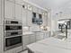 Spacious kitchen featuring stainless steel appliances, ample counter space, and contemporary design elements at 7161 Ne 22Nd Court Rd, Ocala, FL 34479