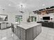 Kitchen island features a farmhouse sink and pendant lighting at 7161 Ne 22Nd Court Rd, Ocala, FL 34479