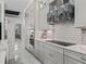 Bright kitchen with updated appliances, white countertops, decorative backsplash, and ample storage at 7161 Ne 22Nd Court Rd, Ocala, FL 34479
