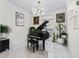 A cozy living room offering a piano, artwork, and natural lighting from the window at 7161 Ne 22Nd Court Rd, Ocala, FL 34479