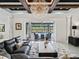 Spacious living room with a view of the screened-in pool at 7161 Ne 22Nd Court Rd, Ocala, FL 34479