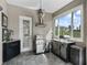 Covered outdoor kitchen featuring stainless steel appliances and a view of the backyard at 7161 Ne 22Nd Court Rd, Ocala, FL 34479