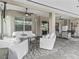 Covered patio area with comfortable seating, perfect for outdoor entertaining at 7161 Ne 22Nd Court Rd, Ocala, FL 34479