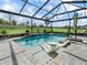Inviting in-ground pool with a screened enclosure and a beautifully landscaped backyard at 7161 Ne 22Nd Court Rd, Ocala, FL 34479