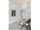 Bright sitting area featuring plush seating, natural light, and stylish chandelier at 7161 Ne 22Nd Court Rd, Ocala, FL 34479