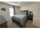A bedroom showcasing a gray bed frame with side table and decor at 7198 Sw 136Th Street Rd, Ocala, FL 34473