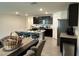 Modern kitchen with a large island, stainless steel appliances, and dark cabinetry at 7198 Sw 136Th Street Rd, Ocala, FL 34473
