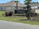 Community entrance sign for Huntington Ridge, surrounded by well-maintained landscaping and palm trees at 7198 Sw 136Th Street Rd, Ocala, FL 34473