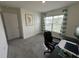 Bright office space with a gray carpet, a modern desk and a view of the outdoors at 7198 Sw 136Th Street Rd, Ocala, FL 34473